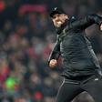 Jurgen Klopp celebrates after a dramatic 4-3 win over Crystal Palace at Anfield on Saturday extended his Liverpool side's lead at the top of the Premier League table to seven points