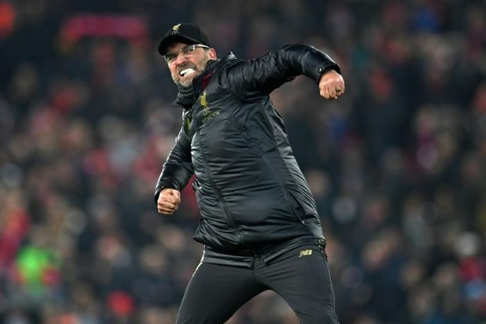 Jurgen Klopp celebrates after a dramatic 4-3 win over Crystal Palace at Anfield on Saturday extended his Liverpool side's lead at the top of the Premier League table to seven points