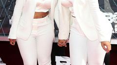 Amber Rose and Blac Chyna share a kiss at the 2015 BET Awards