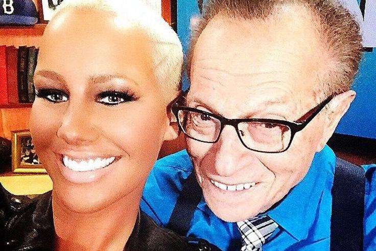 Amber Rose and Larry King enjoy a selfie together