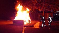 The Ferrari on fire in front of a brothel
