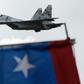 In this file picture taken on July 5, 2017, a Russian-made Venezuelan Air Force Sukhoi Su-30MKV multirole strike fighter overflies a military parade in Caracas