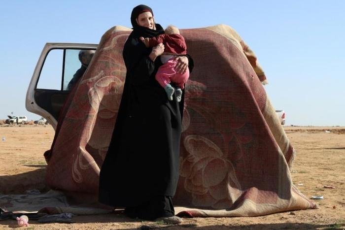 Leonora, a 19-year-old German national who married into the Islamic State group, awaits screening and registration by the Syrian Democratic Forces