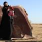 Leonora, a 19-year-old German national who married into the Islamic State group, awaits screening and registration by the Syrian Democratic Forces