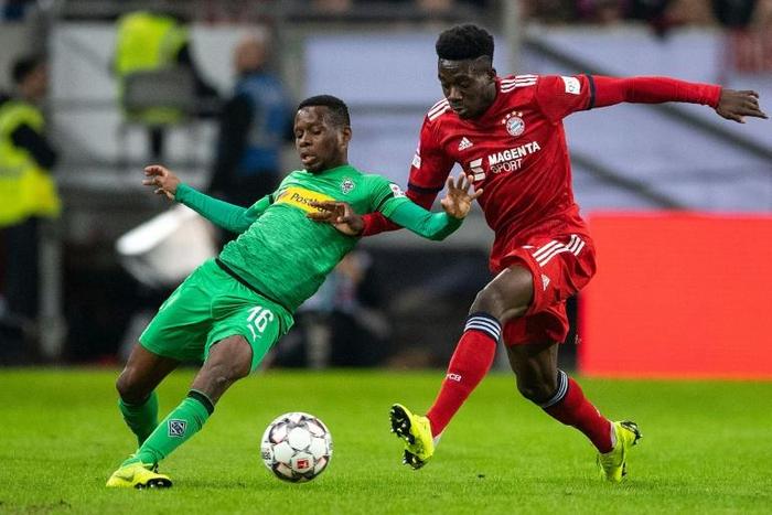 Canadian midfielder Alphonso Davies (R) could make his Bundesliga debut on Friday night after his first appearance for Bayern Munich in Sunday's victory over Borussia Moenchengladbach in the final of a four-team mini tournament in Duesseldorf.