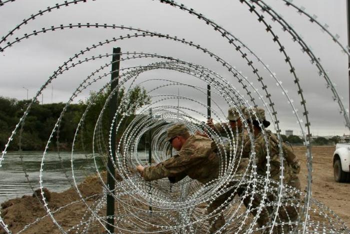The troops' role so far has primarily been to erect miles of concertina-wire fencing along popular crossing points