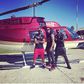 Psquare and Flavour in front of a chopper at the music video shoot