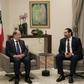 Lebanese President Michel Aoun (L) and Prime Minister Saad Hariri in discussion at the presidential palace, as a new government is formed more than eight months after elections