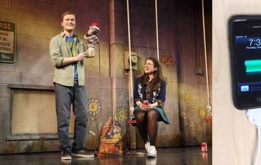 Left: The play continued after the disruption. Right: The iPhone the man tried to charge.