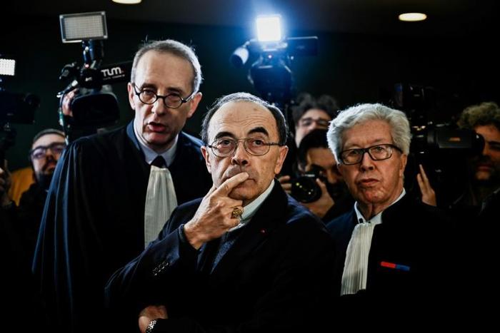 The Archbishop of Lyon Cardinal Philippe Barbarin (centre) denies covering up child sexual abuse by a priest