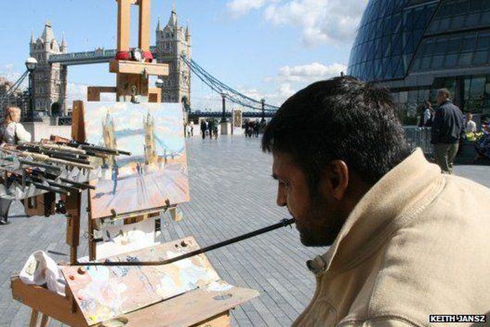 Keith Jansz paints with his mouth ever since his shoulder injury 20 years ago