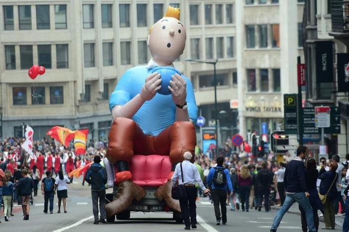 An inflatable of Belgian comics series character Tintin is paraded during the Balloon's Day Parade as part of the annual Comic Book Festival in Brussels on September 6, 2014