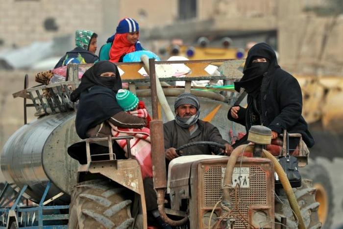Civilians return to the town of Hajin in Syria's eastern Deir Ezzor province on January 27, 2019 after the Kurdish-led and US-backed Syrian Democratic Forces retook the city from jihadists of the Islamic State group