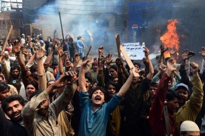 A mob (file photo) attacked a Christian couple after accusing them of desecration of the holy Koran and later burnt their bodies at a brick kiln where they worked