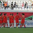 China's players celebrate scoring in their narrow win 2-1 over Kyrgyzstan in the Asian Cup