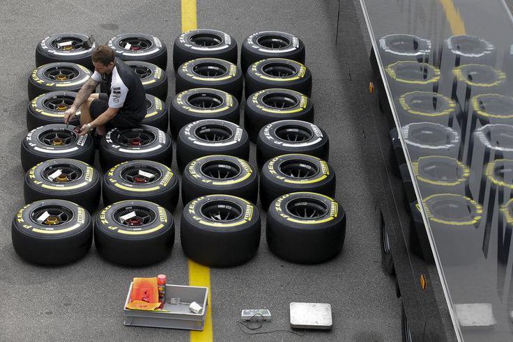 A Mercedes mechanic checks the pressure of Pirelli tyres ahead of the Italian F1 Grand Prix in Monza September 3, 2015. REUTERS/Max Rossi