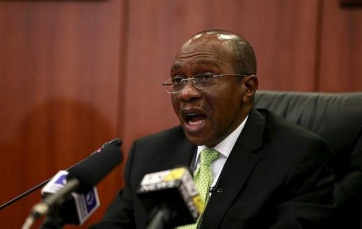 Governor Godwin Emefiele announces that Nigeria's central bank is keeping its benchmark interest rate on hold at 13 percent in Abuja, Nigeria, July 24, 2015. REUTERS/Afolabi Sotunde