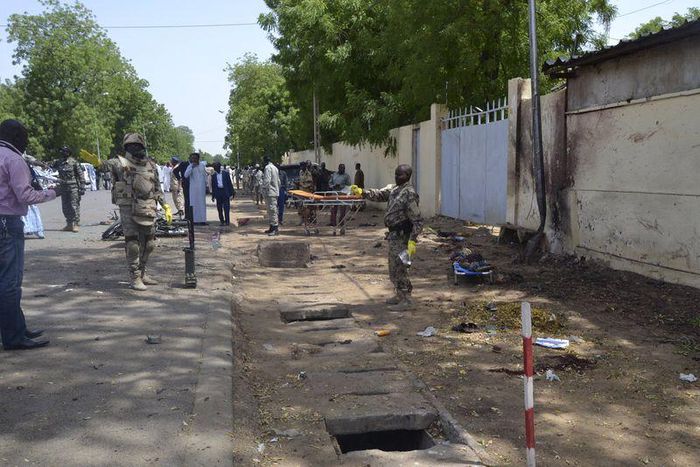 Security officers secure the site of a suicide bombing in Ndjamena, Chad, June 15, 2015. At least 27 people, including four suspected Boko Haram Islamist fighters, were killed and 100 others were injured on Monday in two attacks in Chad's capital, N'Dj...