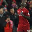 Sadio Mane celebrates after giving Premier League leaders Liverpool an early lead in an eventual 1-1 draw with Leicester at Anfield