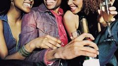 A man partying with two ladies