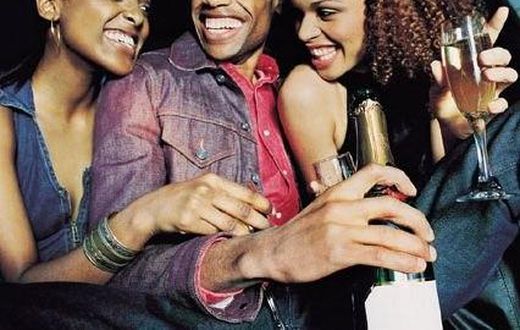 A man partying with two ladies