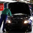 A worker inspects cars at BMW's manufacturing plant in Rosslyn, outside Pretoria, September 13, 2010. REUTERS/Siphiwe Sibeko