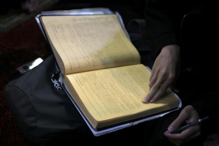 A student reads at Al-Azhar mosque, which developed into a prestigious Islamic university where the female student seen in the viral video studies