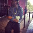 Davido flashing two wads of $100 bills at the Palms Casino Hotel in Las Vegas ahead of the boxing match