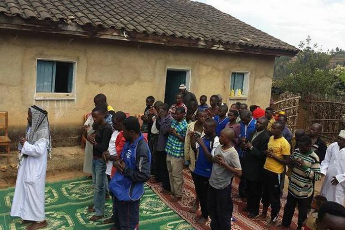 Rwandan pastor and his congregation performing Salat