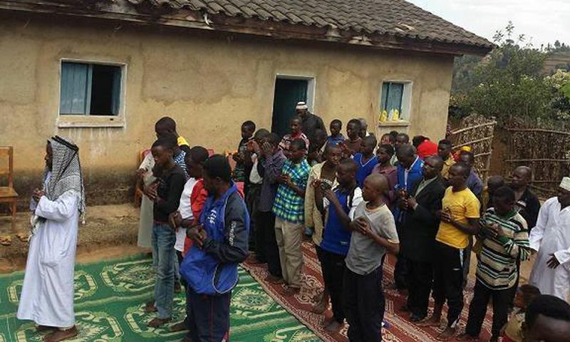 Rwandan pastor and his congregation performing Salat