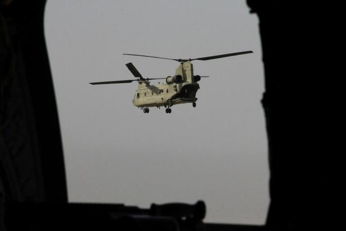 A US Chinook military helicopter flies towards NATO's Resolute Support mission in Kabul last year