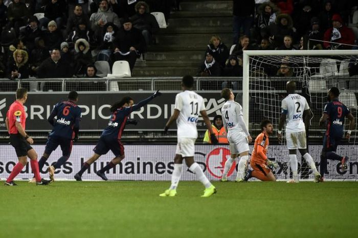 Jason Denayer wheels away to celebrate after scoring Lyon's winner against Amiens