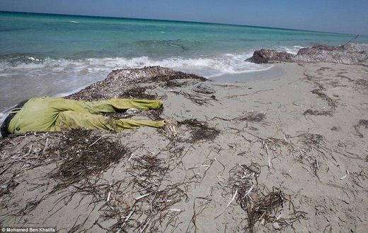 Bodies: Migrants desperate to reach Europe take on the treacherous journey across the Mediterranean but hundreds of their bodies have washed up on the beaches of Libya