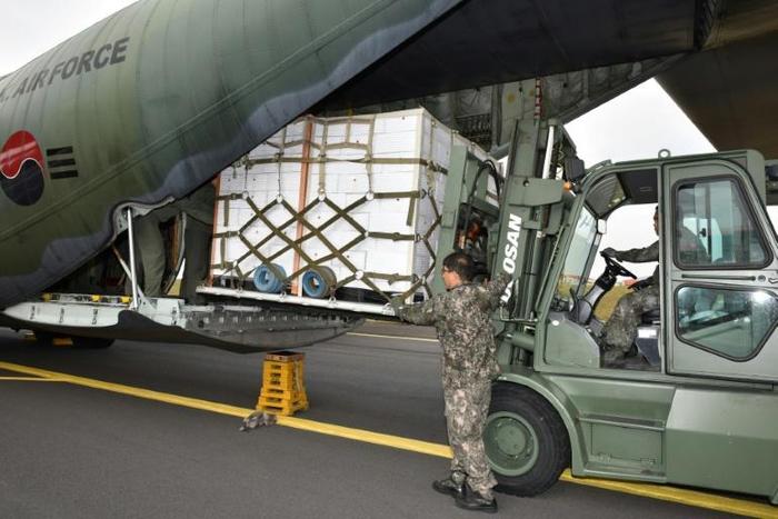 A South Korean military transport aircraft is loaded with tangerines bound for North Korea in November 2018 as the North struggles with a food crisis