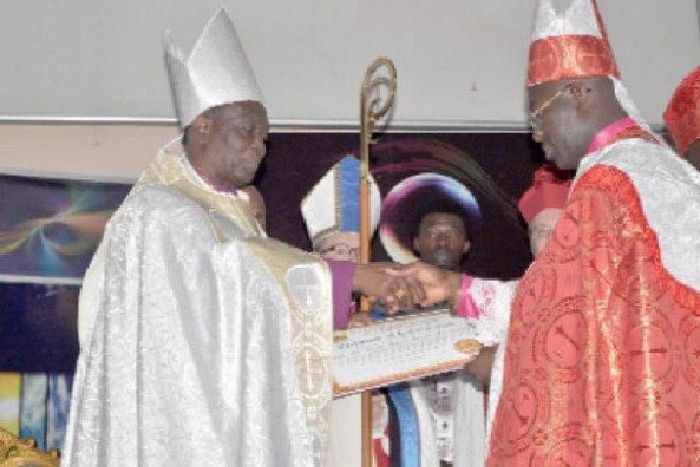 Dr Asafo-Agyei Anane Frempong (left) receiving the certificate of office after being sworn in