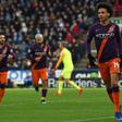 Leroy Sane (R) celebrates after finishing a finishing a fine move to score the third goal in Manchester City's 3-0 win away to Huddersfield on Sunday