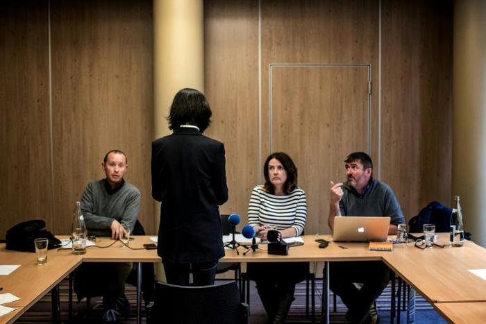 Grace Meng, facing away from the camera, says she has feared for her life after her husband, former Chinese Interpol chief Meng Hongwei, was arrested in China in September