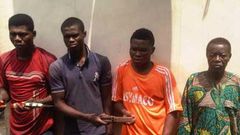 Najim Bakare (right) with other suspects.