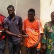 Najim Bakare (right) with other suspects.