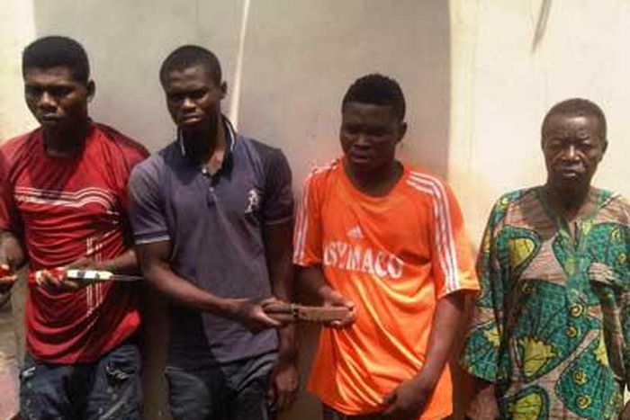 Najim Bakare (right) with other suspects.