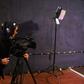 An Afghan camerawoman films for the Zan TV (Women's TV) station in Kabul. Under the Taliban women were barred from almost all employment and television was banned