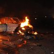 Car burns following a bomb blast in Abuja on 1 May 2014