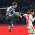 Bayern Munich striker Thomas Mueller is suspended for both legs of their Champions League last 16 matches against Liverpool for this kick on Ajax's Argentine defender Nicolas Tagliafico during December's 3-3 draw in Amsterdam in the group stages.