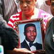 Gwen Carr holding a photo of her late son, Eric Garner