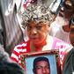 Gwen Carr holding a photo of her late son, Eric Garner