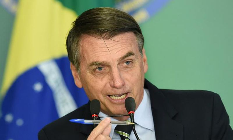 Brazilian President Jair Bolsonaro before signing a decree that makes it easier for adults with no criminal records to buy guns and keep them at home