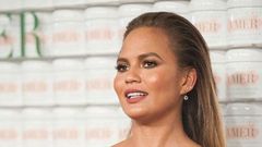 Chrissy Teigen shows off baby bump
