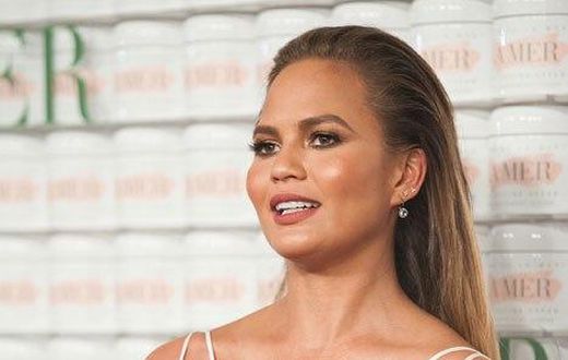 Chrissy Teigen shows off baby bump