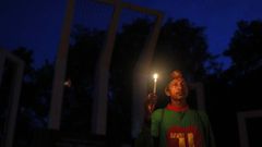 A Bangladeshi activist holds a candle, as they protest against the killing of secular blogger Niloy Chakrabarti in Dhaka, Bangladesh.