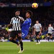 Christian Atsu fights for the ball with Chelsea's Willian